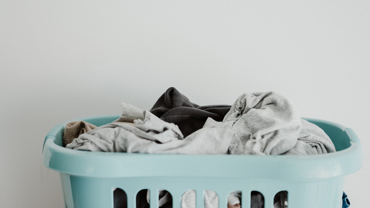 Clean laundromat interior with folding tables and commercial dryers