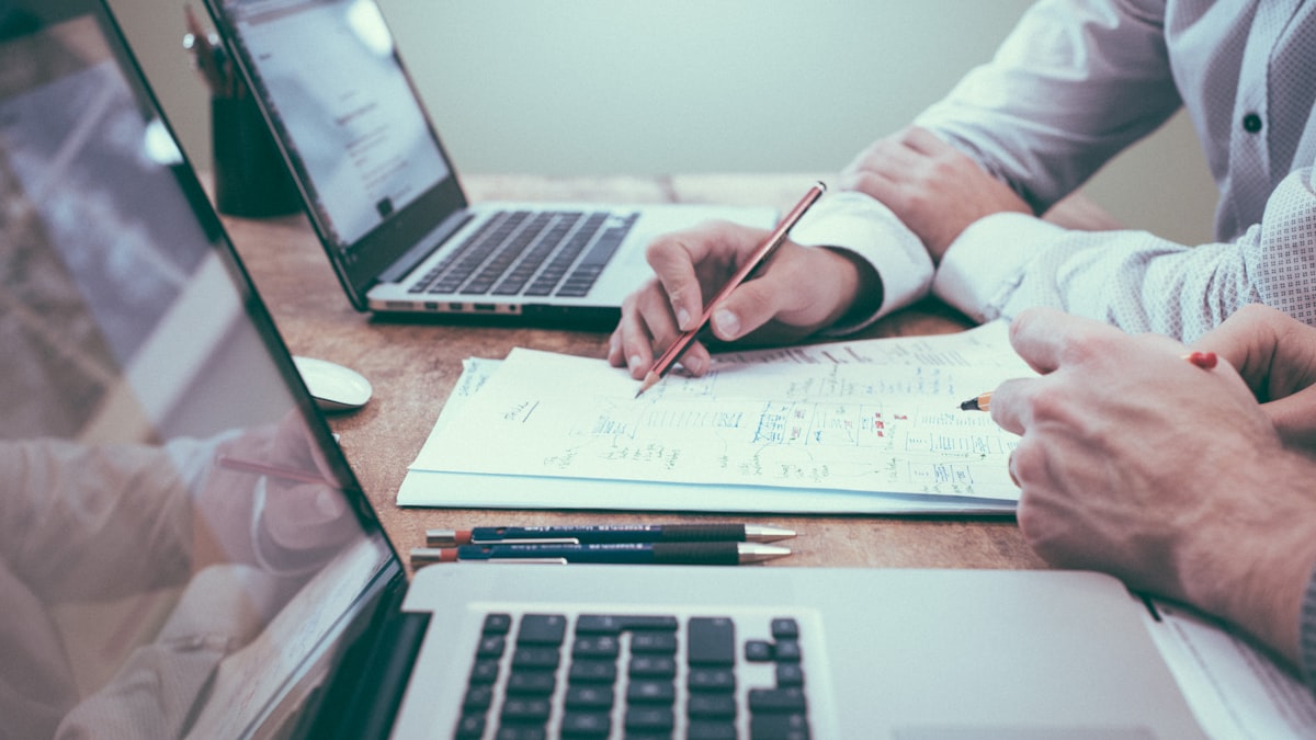 Entrepreneur analyzing business location data on laptop