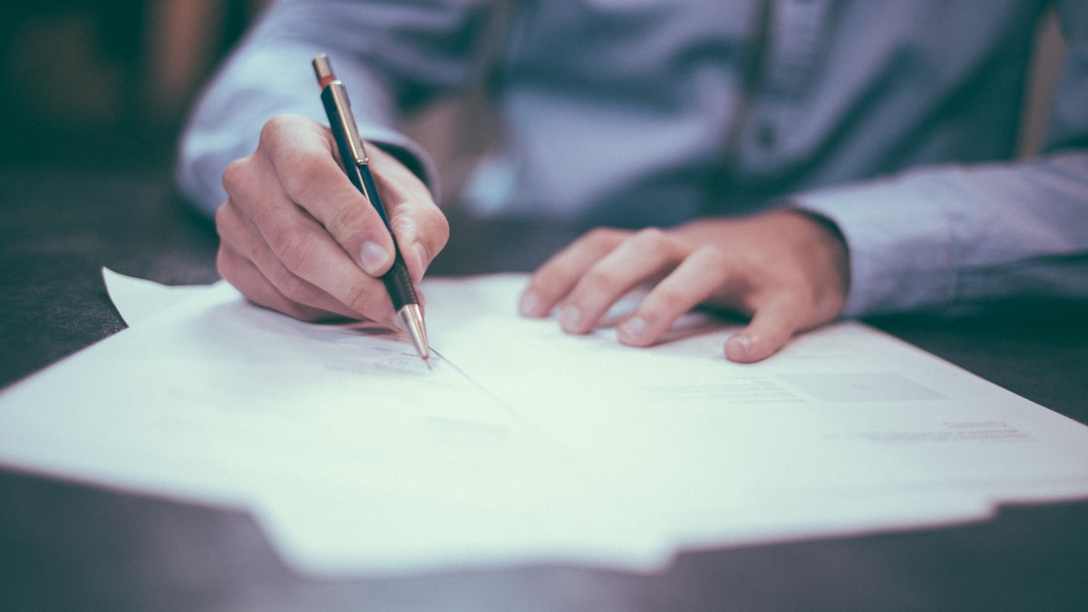 Business owner reviewing lease documents considering relocation