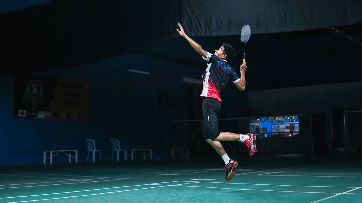 Indoor pickleball courts with players during a match