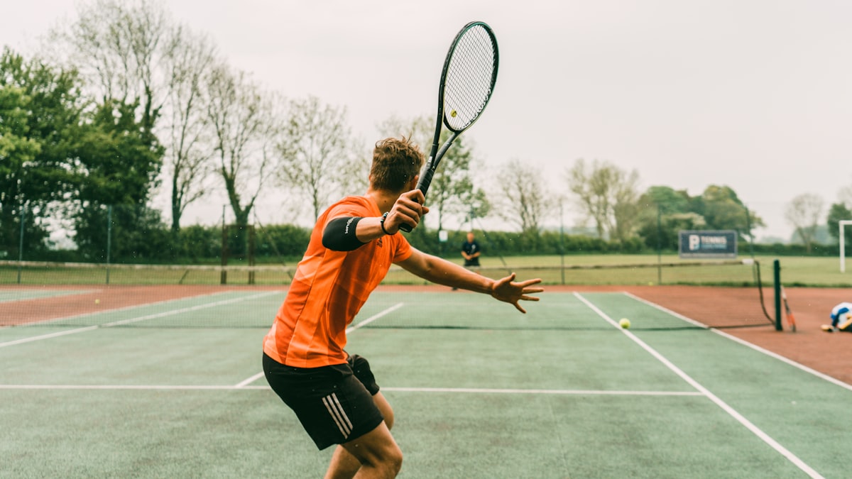 Padel court with glass walls and artificial turf surface
