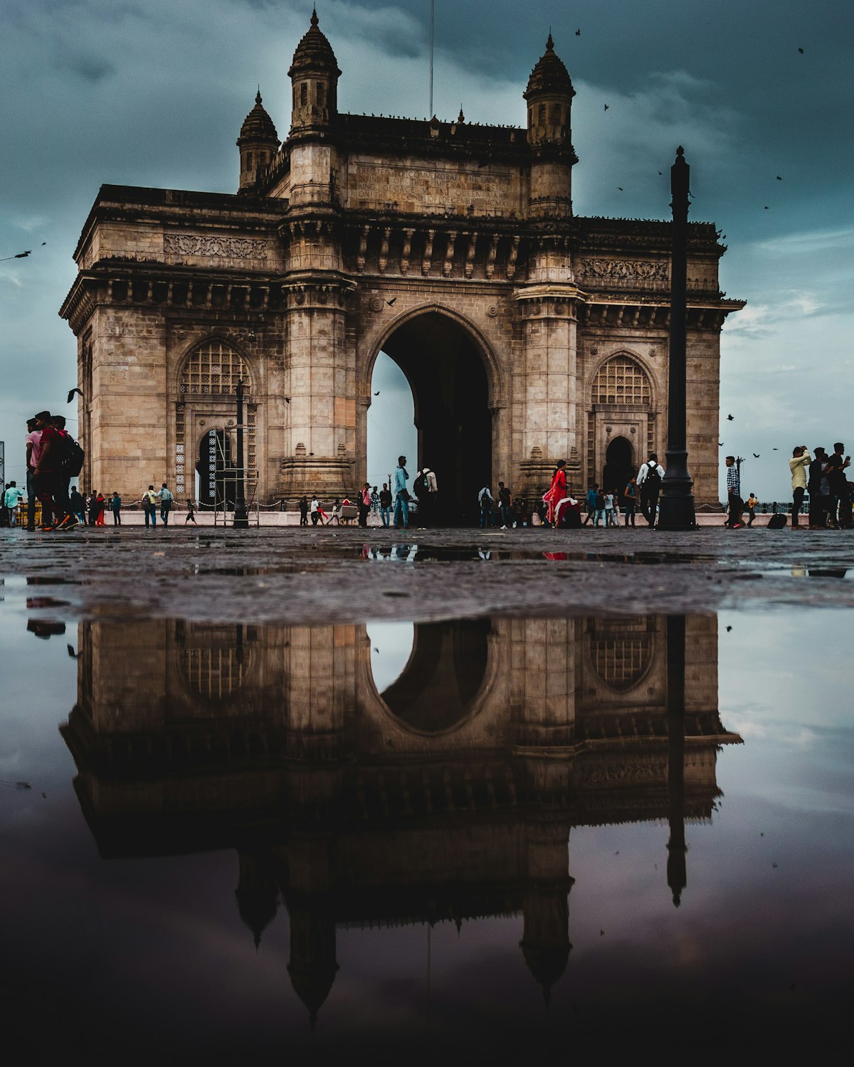 Mumbai commercial street with shops and pedestrian activity